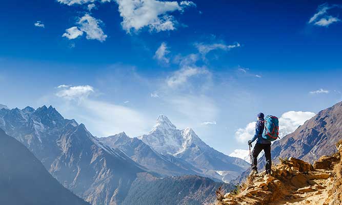 hiker achieving life goals in the Himalayas