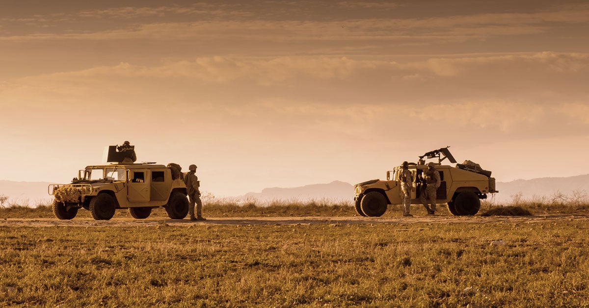 Two military humvees