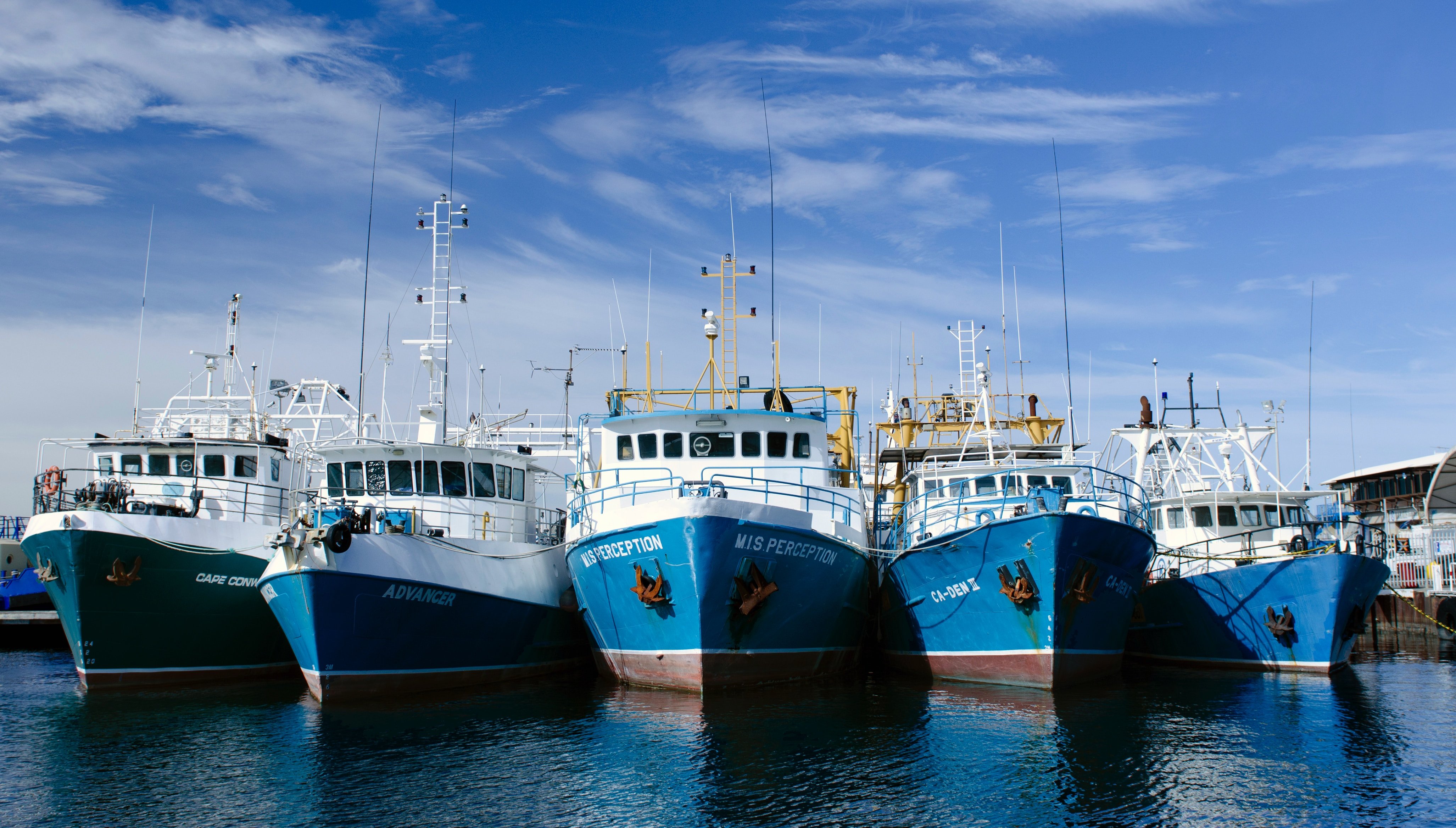 Five fishing boats lined up