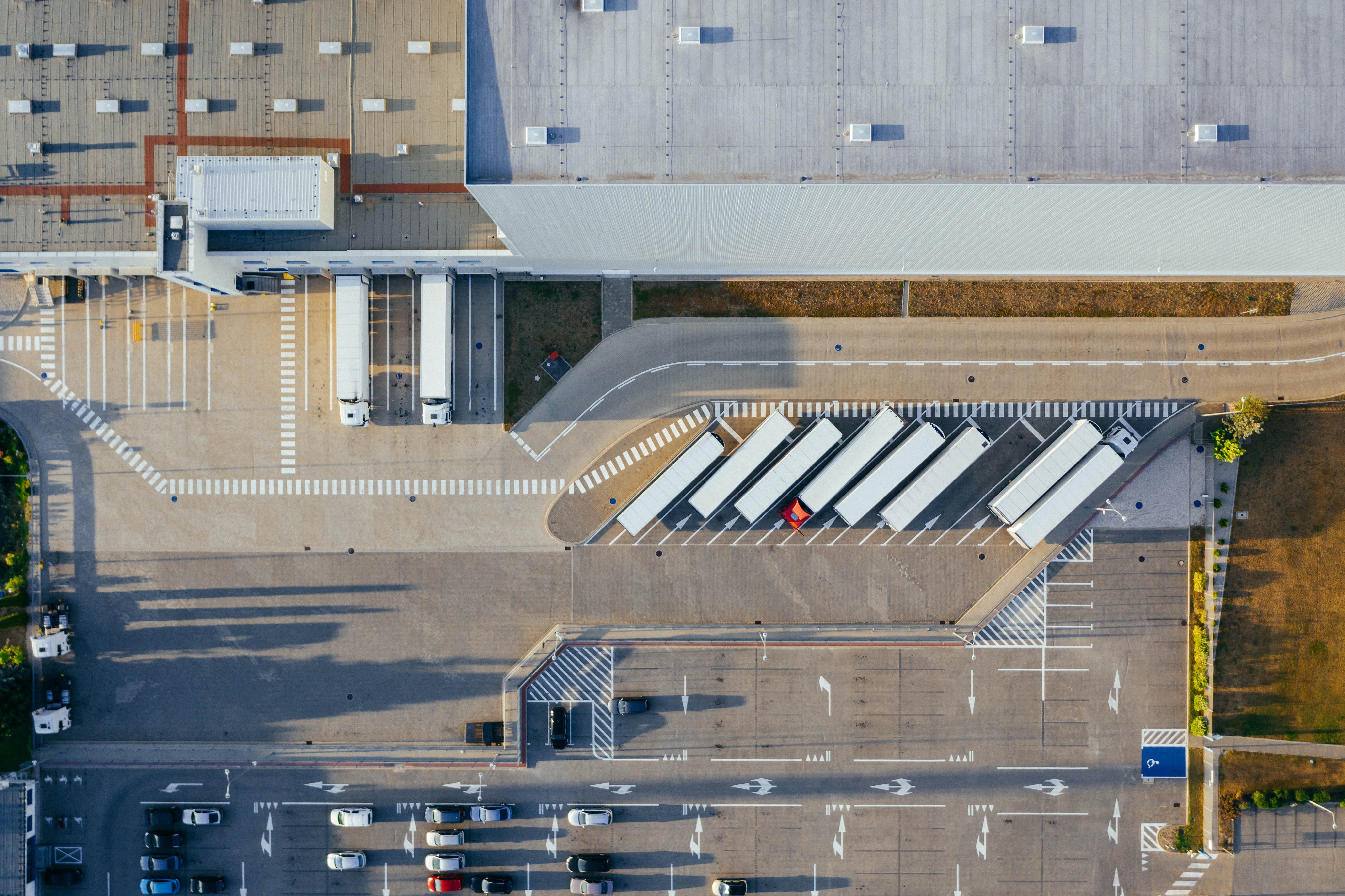 Aerial shot of a trucking depot with several trucks parked