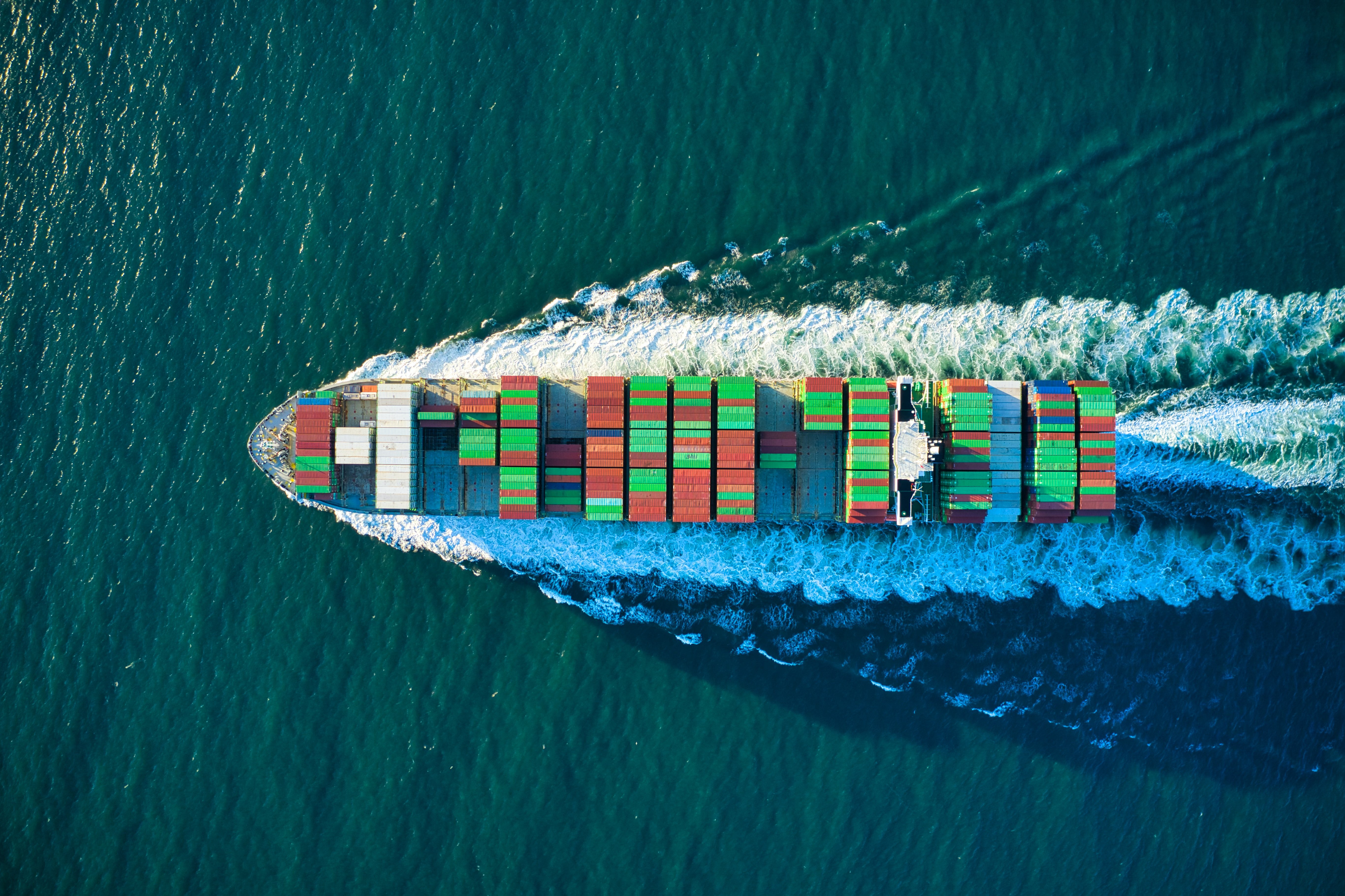 Aerial shot of a ship moving in water